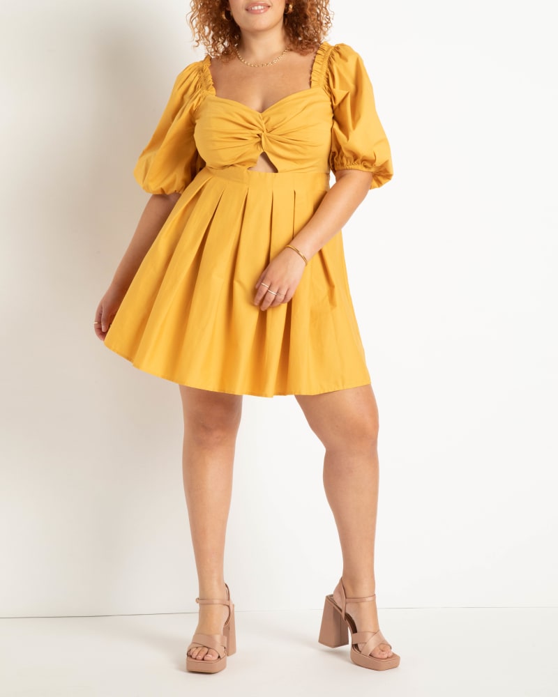 Front of a model wearing a size 20 Twist Bodice Puff Sleeve Dress in Narcissus by ELOQUII. | dia_product_style_image_id:275264